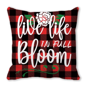 Red and black buffalo plaid pillow cover featuring white rose and bloom text