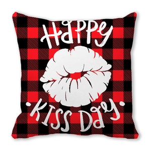 Square red and black buffalo plaid pillow cover with white lip print and Happy Kiss Day text