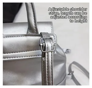 Detail of adjustable silver metallic shoulder strap with premium hardware buckles