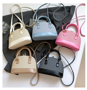 Five woven shell bags in beige, blue, pink, khaki, and black with leather straps