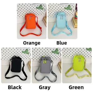 Detailed view of lightweight canvas mini bags in orange blue black grey and green colors