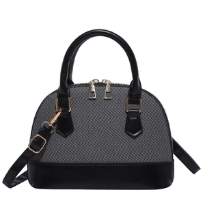 Classic black and grey textured shell bag with golden metal hardware and top handles