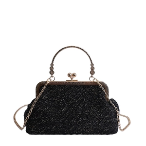 Elegant black glitter vintage kiss-lock bag with gold floral handle and long chain strap