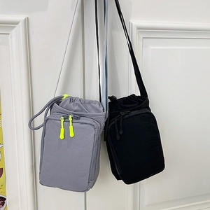 Minimalist canvas phone bag in grey and black with drawstring and shoulder strap