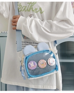Blue canvas crossbody bag featuring cute rabbit ears and transparent pocket with badges