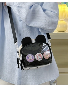 Cute black ita bag with transparent front window and rabbit ears worn by a model