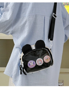 Detail of cute rabbit crossbody bag with clear display window and adjustable strap