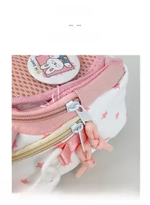 Close-up of pink mesh and white star pattern crossbody bag with a cute rabbit badge