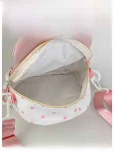 Internal display of star pattern crossbody bag showing white lining and storage space