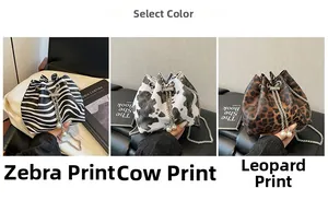 Zebra, cow, and leopard print bucket bags with chain straps and pearl charms