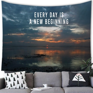 Sunset beach tapestry wall hanging with inspirational quote in a modern living room
