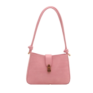 Pink croc-embossed underarm bag with knotted shoulder strap and vintage metal clasp