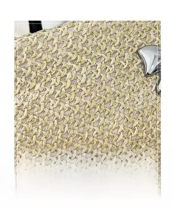 Macro detail of beige woven texture featuring a decorative silver butterfly metal buckle