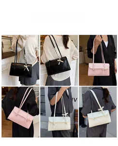 Sac baguette de style ballet français avec bretelles à nœuds en noir, rose et beige