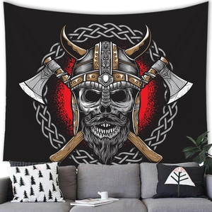 Viking skull tapestry with Celtic knots and axes hanging above a grey sofa