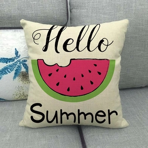 Linen square pillow featuring Hello Summer text and watermelon on a grey sofa