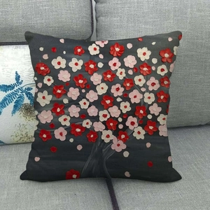 Detailed close-up of oil painting tree linen pillowcase on a grey fabric sofa