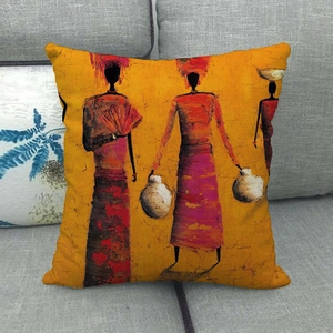 Detail of African oil painting style cushion cover on gray sofa showing cotton linen texture