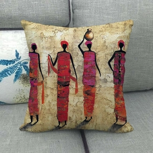 African art style decorative cushion cover with ethnic women figures on grey sofa