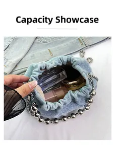 Capacity display of light blue denim bucket bag with silver metal bead chain handle