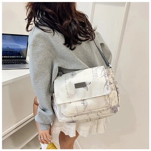 Model wearing a butterfly print messenger bag in a daily setting showing side structure