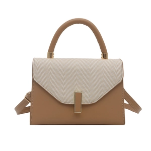 Minimalist beige woven patchwork handbag with brown leather flap and golden clasp