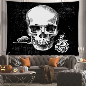 Detailed view of skull and rose tapestry hung in a cozy Halloween living room setting