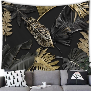 Detail of high-density black and gold tropical leaf tapestry fabric texture on grey wall
