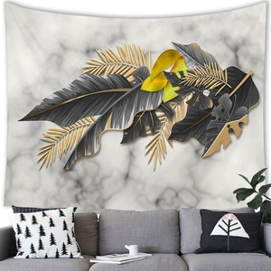 Detail of Nordic tropical leaf tapestry featuring gold and black marble texture finish