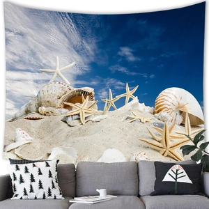 Detail of nautical beach tapestry with starfish and seashells hanging over a modern sofa