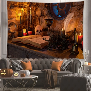 Detail view of gothic Halloween tapestry featuring skulls and candles above a sofa