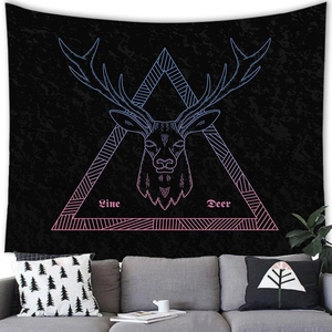 Detail showing neon geometric deer head print on black fabric tapestry hanging over sofa