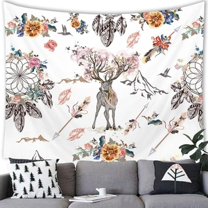 Detailed view of bohemian elk tapestry featuring pink flowers and dreamcatchers