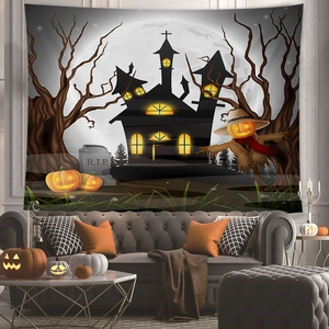 Close-up of Halloween tapestry featuring a glowing castle, tombstones and pumpkins