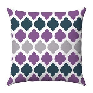 Close-up of square pillowcase featuring purple and navy geometric quatrefoil patterns