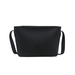 Minimalist black lychee texture leather bucket bag with embossed logo on white background