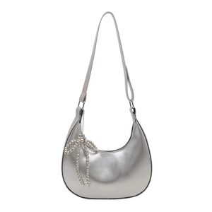 Chic silver crescent hobo bag with metallic finish and pearl bow charm accessory