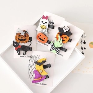Halloween hair clip set with pumpkin, ghost, and black cat designs on white cards