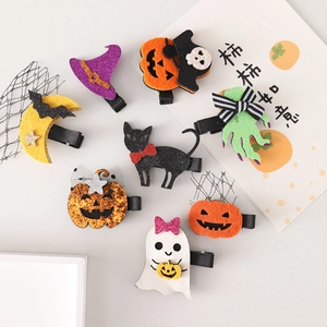 Halloween hair clip set with pumpkin, ghost, and bat designs featuring glitter sequins
