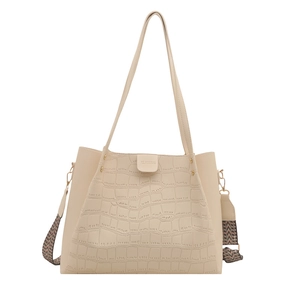 Minimalist cream tote bag with crocodile pattern and wide geometric shoulder strap