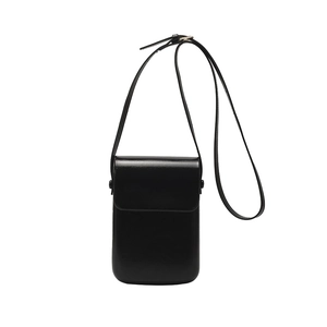 Minimalist black shiny leather crossbody phone bag with adjustable shoulder strap