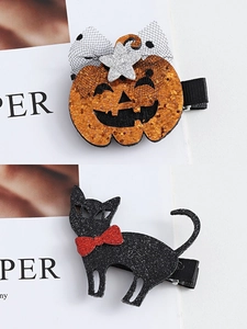 Detail of Halloween hair clips with glitter pumpkin and black cat on duckbill clips