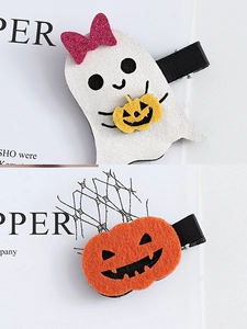Detail of glitter ghost and felt pumpkin hair clips with black ribbon lined alligator clips