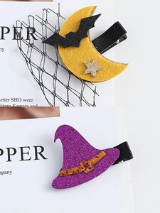 Detail of Halloween hair clips with glitter bat on moon and purple wizard hat designs