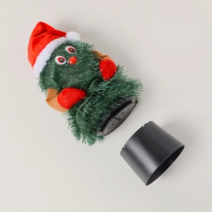 Detail view of the internal mechanism and black plastic base of a dancing Christmas tree