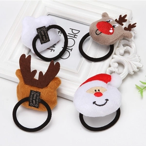 Set of four cute plush Christmas hair ties featuring Santa and reindeer on white frame