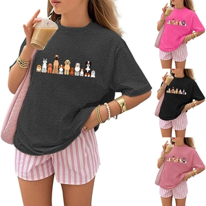 Detailed view of women's short-sleeved puppy print T-shirts in grey, pink, black, and red