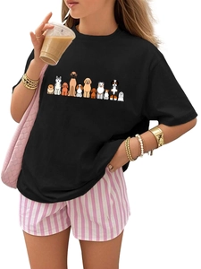 Detail of soft black cotton t-shirt featuring vibrant cartoon dog prints on the chest