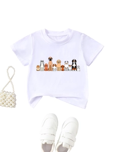 Flat lay of white cotton kids' T-shirt featuring eleven cartoon dog prints and matching shoes