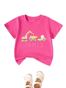 Detail of kids pink cotton T-shirt featuring a yellow excavator design and James lettering